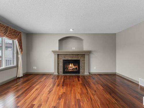 2923 24 Avenue, Edmonton, AB - Indoor Photo Showing Living Room With Fireplace