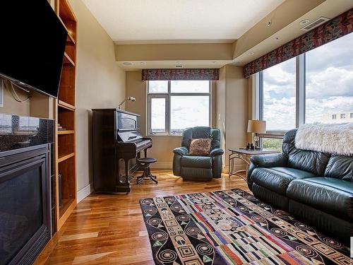 1201 10035 Saskatchewan Drive, Edmonton, AB - Indoor Photo Showing Living Room With Fireplace