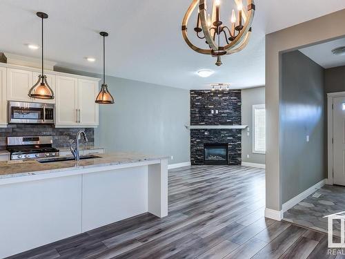 11243 102 Street, Edmonton, AB - Indoor Photo Showing Kitchen With Fireplace With Double Sink