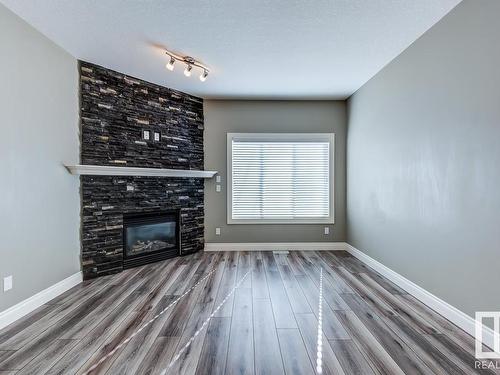 11243 102 Street, Edmonton, AB - Indoor Photo Showing Living Room With Fireplace