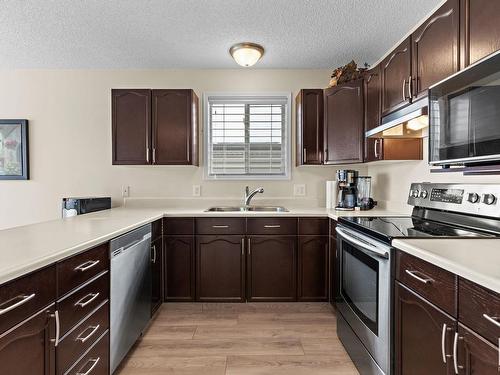 833 116A Street, Edmonton, AB - Indoor Photo Showing Kitchen With Stainless Steel Kitchen With Double Sink