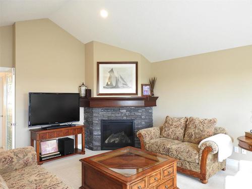 1111 Hainstock Green, Edmonton, AB - Indoor Photo Showing Living Room With Fireplace