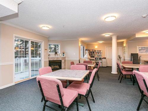 101 17150 94A Avenue, Edmonton, AB - Indoor Photo Showing Dining Room With Fireplace