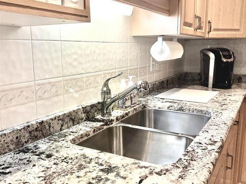 101 17150 94A Avenue, Edmonton, AB - Indoor Photo Showing Kitchen With Double Sink