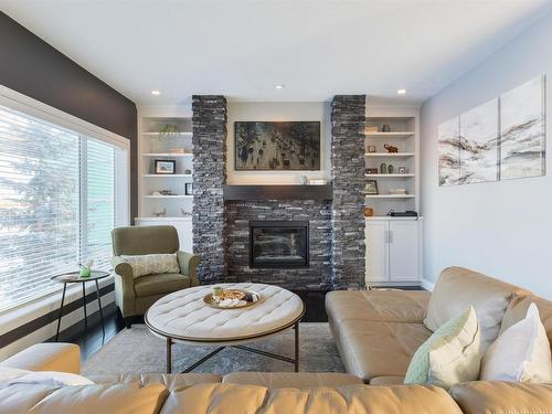 35 10550 Ellerslie Road, Edmonton, AB - Indoor Photo Showing Living Room With Fireplace