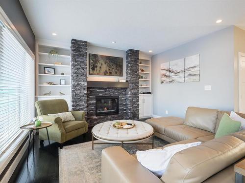 35 10550 Ellerslie Road, Edmonton, AB - Indoor Photo Showing Living Room With Fireplace