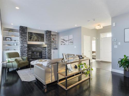 35 10550 Ellerslie Road, Edmonton, AB - Indoor Photo Showing Living Room With Fireplace