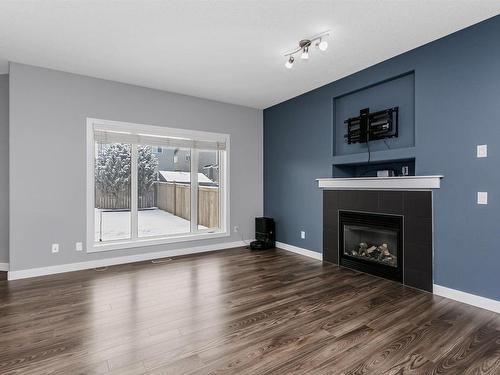 1515 Chapman Way, Edmonton, AB - Indoor Photo Showing Living Room With Fireplace