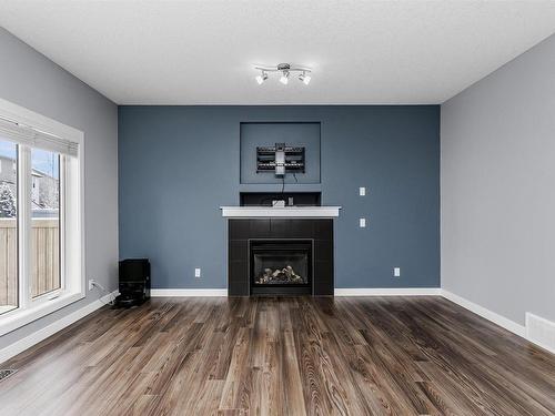 1515 Chapman Way, Edmonton, AB - Indoor Photo Showing Living Room With Fireplace