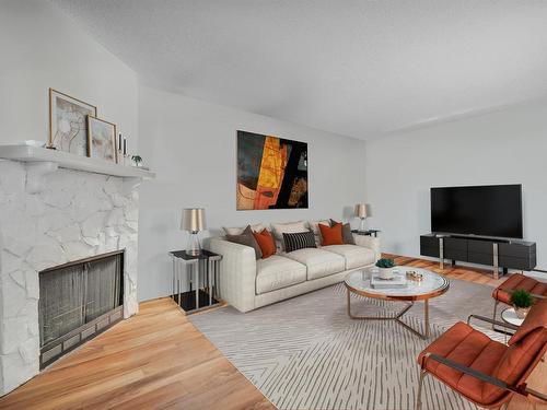 203 10421 93 Street, Edmonton, AB - Indoor Photo Showing Living Room With Fireplace