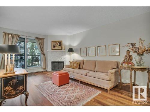 203 10421 93 Street, Edmonton, AB - Indoor Photo Showing Living Room With Fireplace