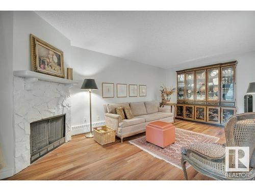 203 10421 93 Street, Edmonton, AB - Indoor Photo Showing Living Room With Fireplace