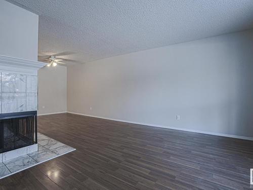 113 2703 79 Street, Edmonton, AB - Indoor Photo Showing Other Room With Fireplace