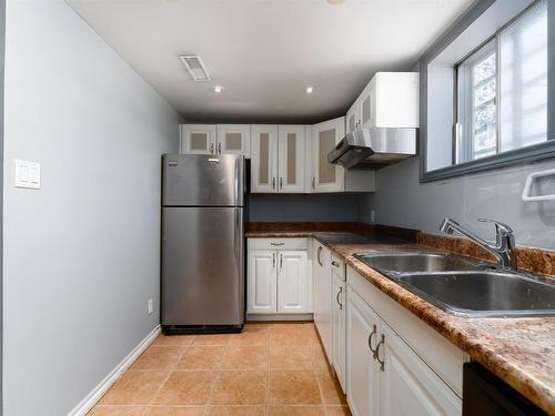 12419 83 Street, Edmonton, AB - Indoor Photo Showing Kitchen With Double Sink