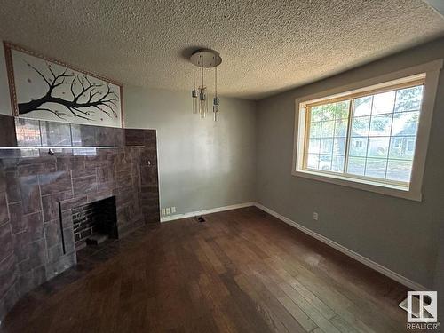 Edmonton, AB - Indoor Photo Showing Other Room With Fireplace