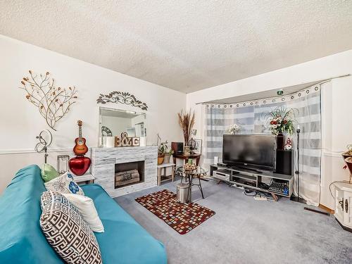 7348 188 Street Nw, Edmonton, AB - Indoor Photo Showing Living Room With Fireplace