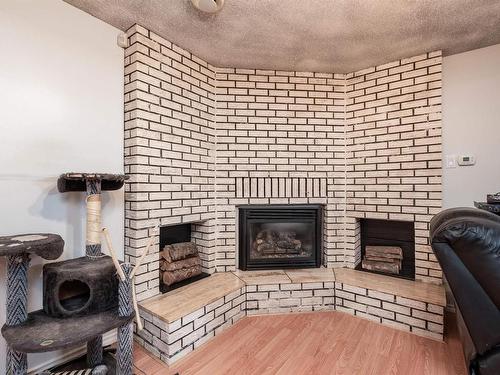 2605 135A Avenue, Edmonton, AB - Indoor Photo Showing Living Room With Fireplace