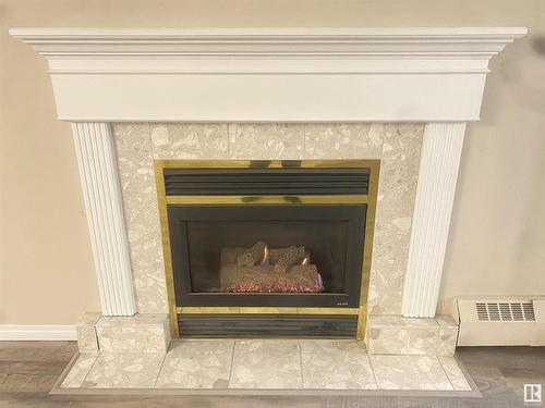 128 15499 Castle Downs Road, Edmonton, AB - Indoor Photo Showing Living Room With Fireplace