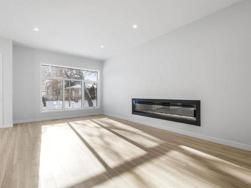 9846 74 Avenue, Edmonton, AB - Indoor Photo Showing Living Room With Fireplace