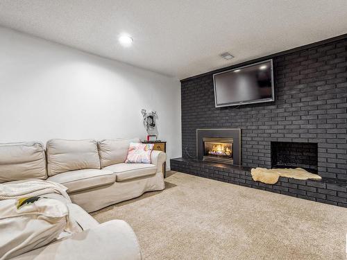 7731 152 Street, Edmonton, AB - Indoor Photo Showing Living Room With Fireplace