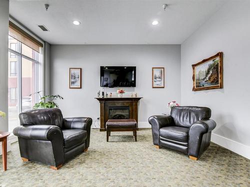 407 6608 28 Avenue, Edmonton, AB - Indoor Photo Showing Living Room With Fireplace