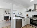 35 230 Edwards Drive, Edmonton, AB  - Indoor Photo Showing Kitchen With Fireplace With Double Sink 