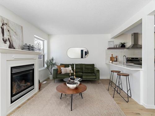 35 230 Edwards Drive, Edmonton, AB - Indoor Photo Showing Living Room With Fireplace