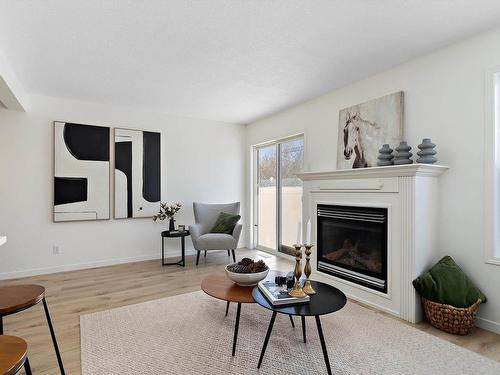 35 230 Edwards Drive, Edmonton, AB - Indoor Photo Showing Living Room With Fireplace