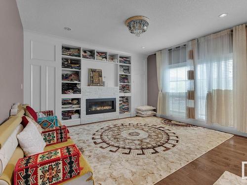 5264 17 Avenue, Edmonton, AB - Indoor Photo Showing Living Room With Fireplace