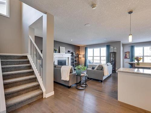 1640 Davidson Green, Edmonton, AB - Indoor Photo Showing Living Room With Fireplace