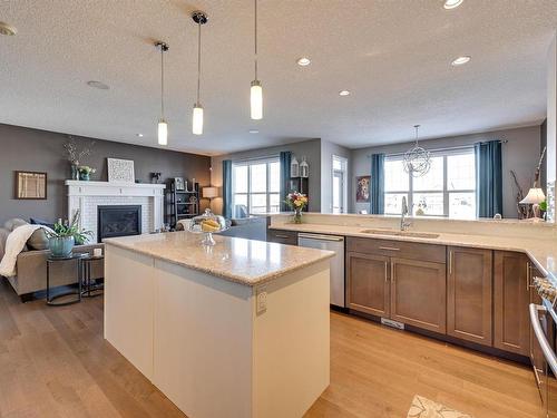 1640 Davidson Green, Edmonton, AB - Indoor Photo Showing Kitchen With Fireplace