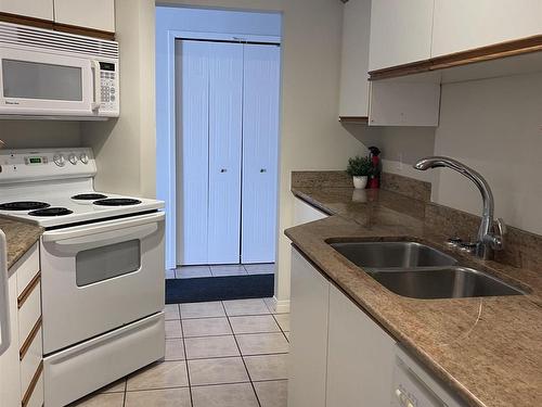 6310 101 Avenue Nw, Edmonton, AB - Indoor Photo Showing Kitchen With Double Sink