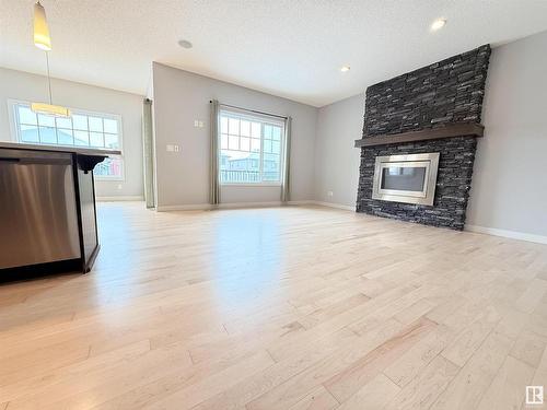 4211 Charles Close, Edmonton, AB - Indoor Photo Showing Living Room With Fireplace