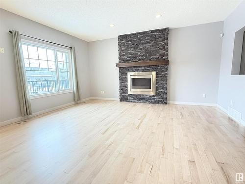 4211 Charles Close, Edmonton, AB - Indoor Photo Showing Living Room With Fireplace