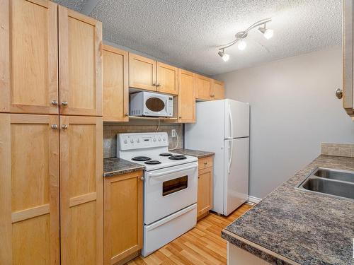 14417 54 Street, Edmonton, AB - Indoor Photo Showing Kitchen With Double Sink