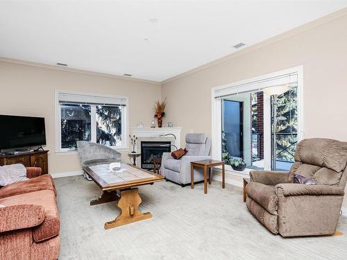 202 14205 96 Avenue, Edmonton, AB - Indoor Photo Showing Living Room With Fireplace