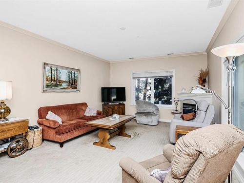 202 14205 96 Avenue, Edmonton, AB - Indoor Photo Showing Living Room With Fireplace