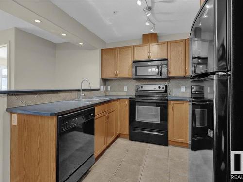 204 11615 Ellerslie Road, Edmonton, AB - Indoor Photo Showing Kitchen With Double Sink