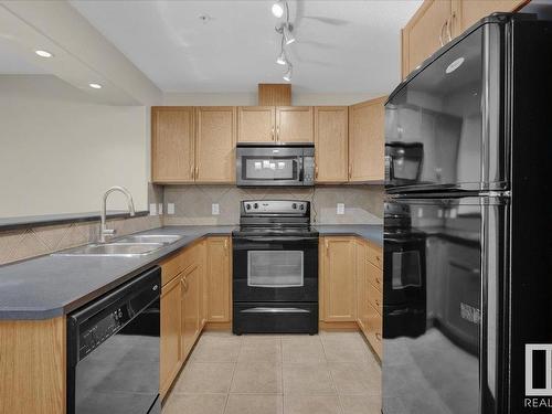 204 11615 Ellerslie Road, Edmonton, AB - Indoor Photo Showing Kitchen With Double Sink