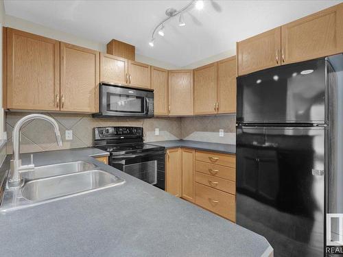 204 11615 Ellerslie Road, Edmonton, AB - Indoor Photo Showing Kitchen With Double Sink