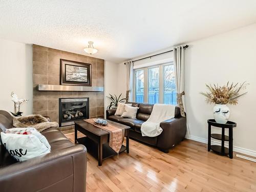 2674 Anderson Crescent, Edmonton, AB - Indoor Photo Showing Living Room With Fireplace