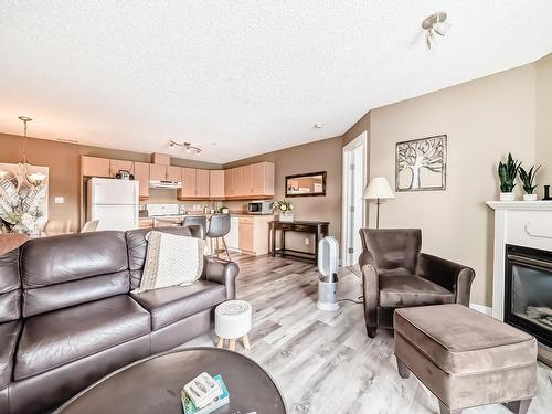 212 16303 95 Street, Edmonton, AB - Indoor Photo Showing Living Room With Fireplace