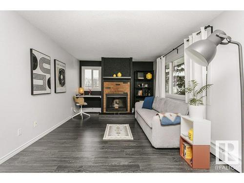 301 10826 113 Street, Edmonton, AB - Indoor Photo Showing Living Room With Fireplace