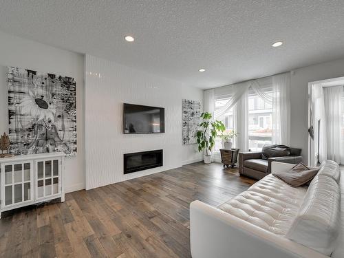 1311 Hainstock Way, Edmonton, AB - Indoor Photo Showing Living Room With Fireplace