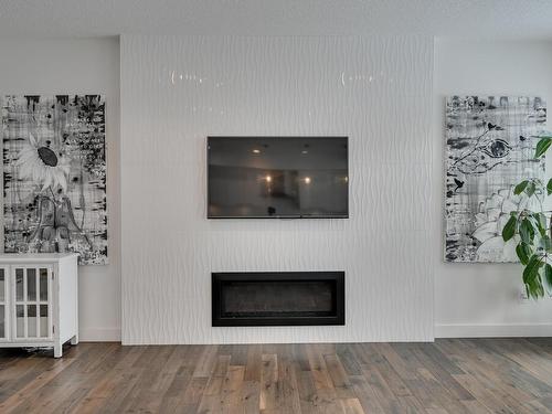 1311 Hainstock Way, Edmonton, AB - Indoor Photo Showing Living Room With Fireplace