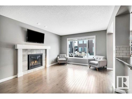 5363 Schonsee Drive, Edmonton, AB - Indoor Photo Showing Living Room With Fireplace