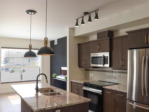 107 10523 123 Street, Edmonton, AB - Indoor Photo Showing Kitchen With Double Sink With Upgraded Kitchen