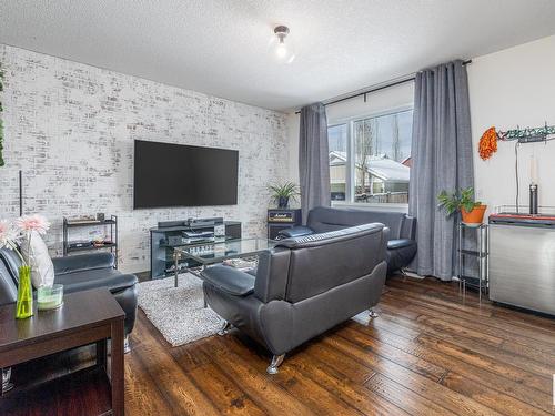 7904 Summerside Grande Boulevard, Edmonton, AB - Indoor Photo Showing Living Room With Fireplace