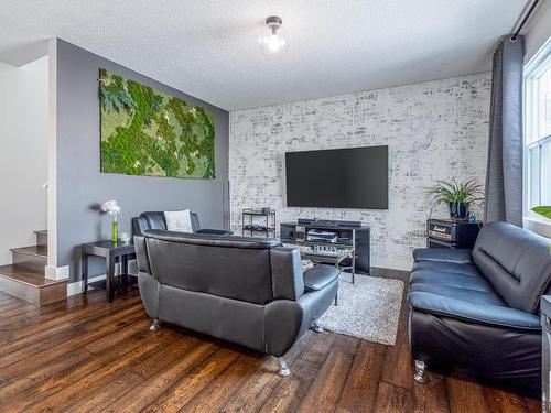 7904 Summerside Grande Boulevard, Edmonton, AB - Indoor Photo Showing Living Room With Fireplace