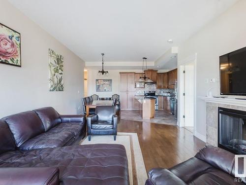 805 10142 111 Street, Edmonton, AB - Indoor Photo Showing Living Room With Fireplace